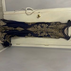 Custom made blue and gold dress. Fits size Large/XL.